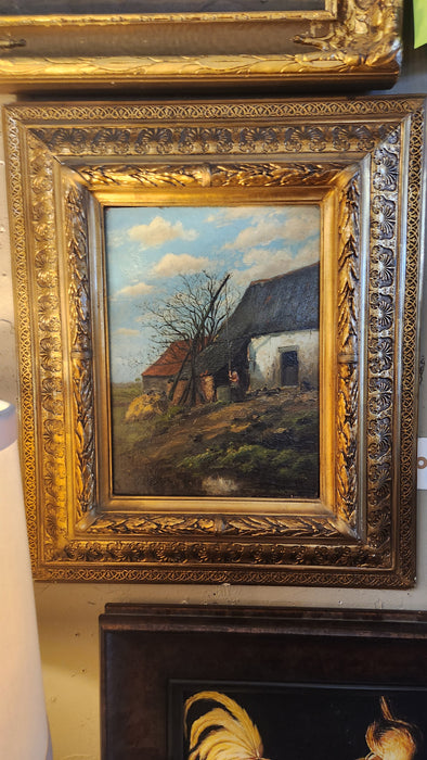 VERTICAL FRAMED OIL PAINTING OF LADY AT A WELL