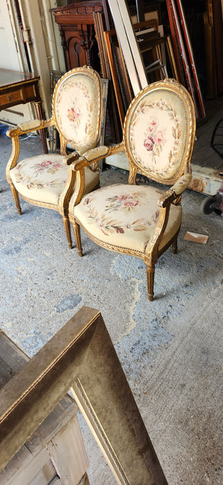 PAIR OF LOUIS XVI NEEDLEPOINT GILT FAUTEUILS (OPEN ARM CHAIRS}