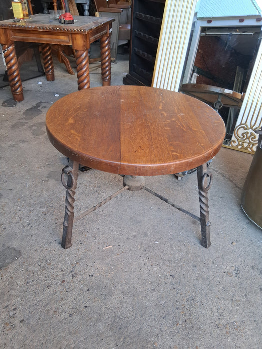 ROUND OAK COFFEE TABLE WITH IRON TWIST LEGS