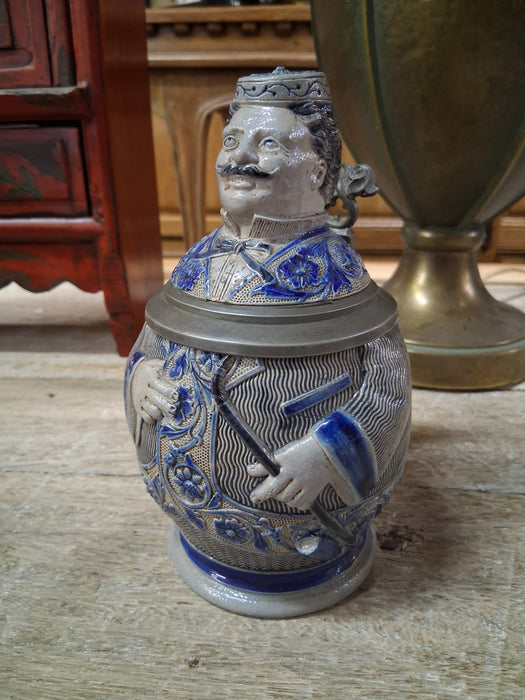 SMALL GREY AND BLUE GERMAN STEIN WITH FIGURAL LID