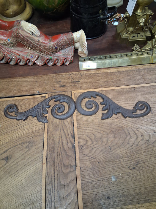 PAIR OF CAST IRON ADORNMENTS