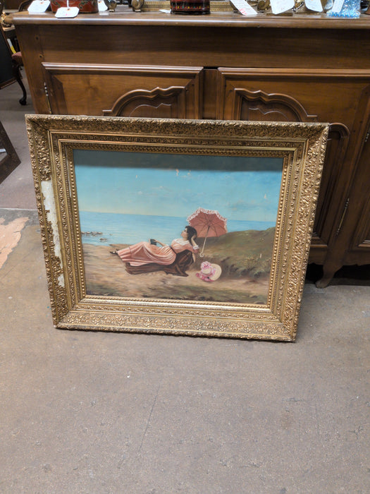 GILT FRAMED OIL PAINTING WITH SUN BATHING WOMAN-AS FOUND