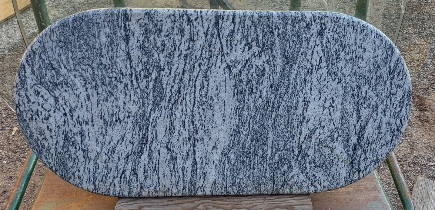 OVAL SLAB OF MARBLE WITH FINISHED EDGE