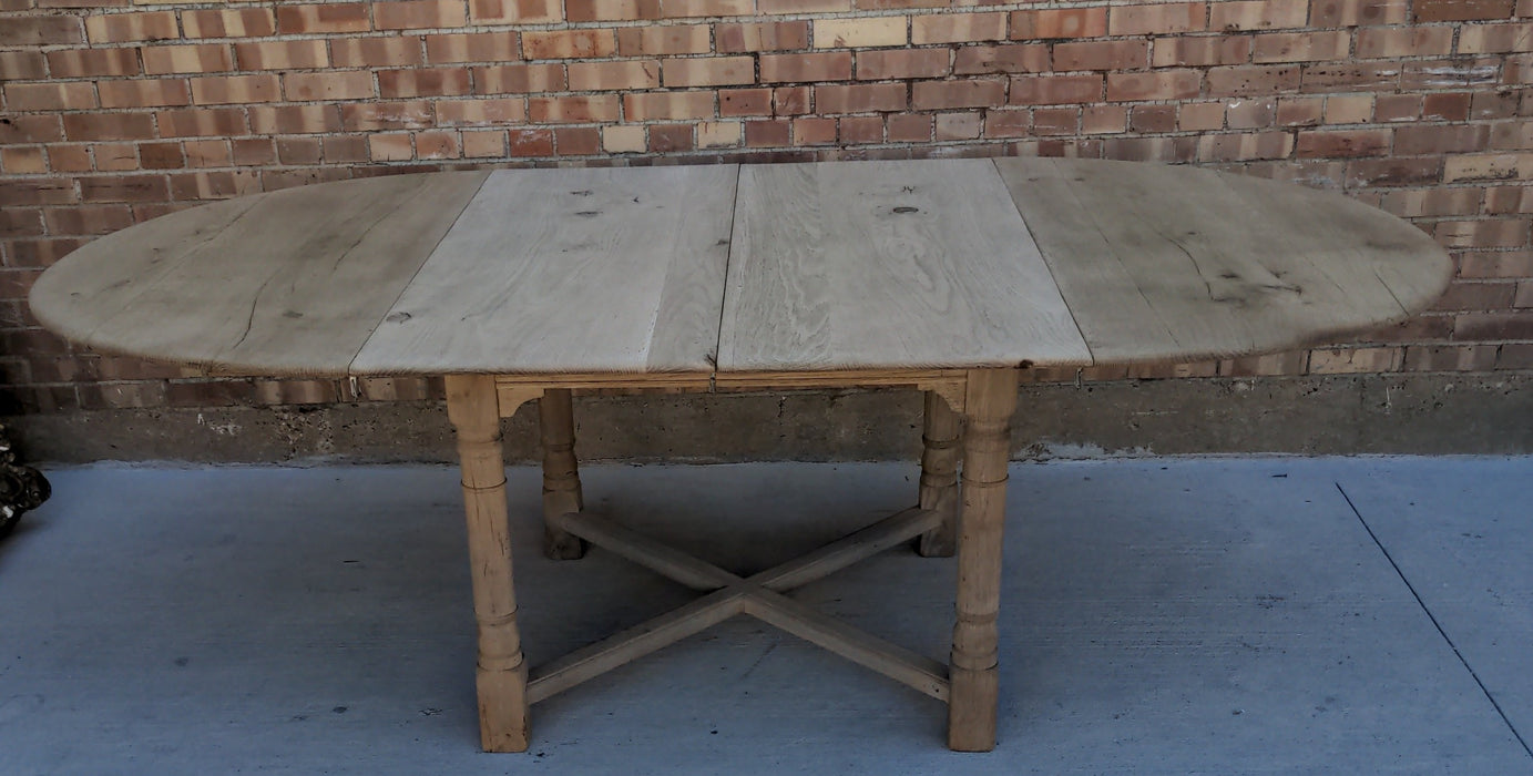 RUSTIC RAW OAK ROUND TABLE WITH TWO LEAVES