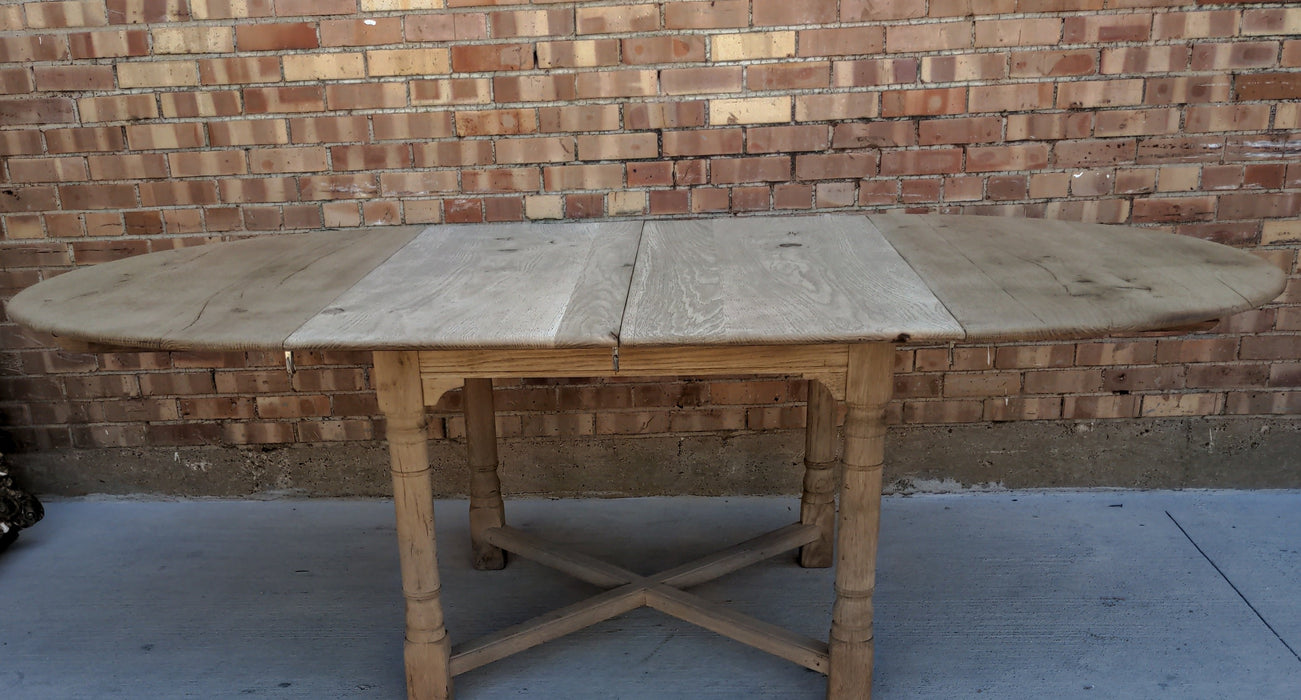 RUSTIC RAW OAK ROUND TABLE WITH TWO LEAVES