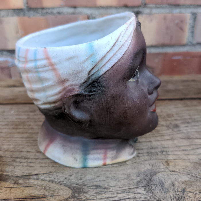 BLACK MEMORABILIA HEAD VASE AS FOUND