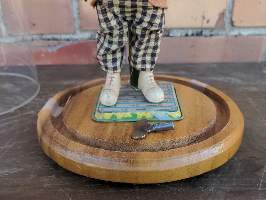 WIND UP TAP DANCER WITH KEY-UNDER GLASS