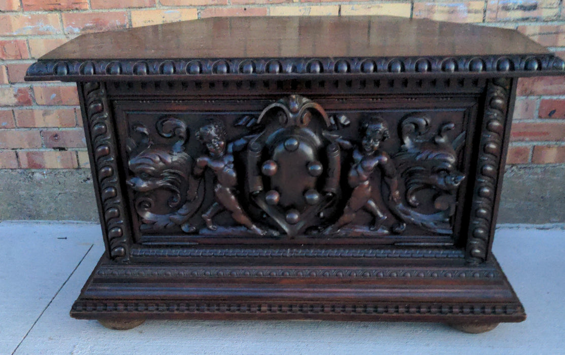 PUTTI CARVED DARK OAK CORNER TABLE