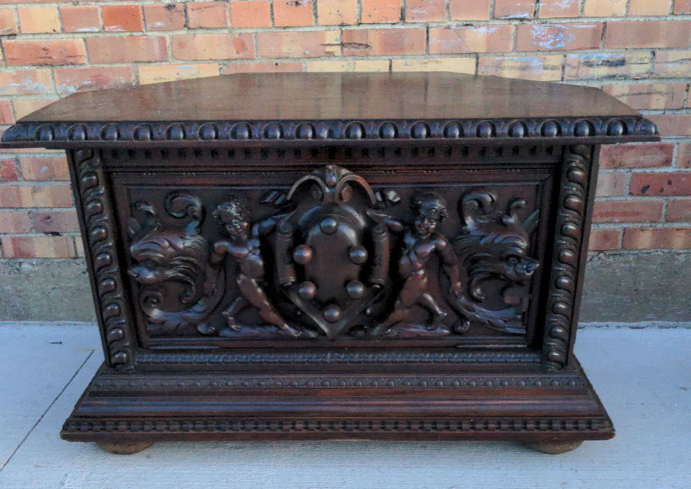 PUTTI CARVED DARK OAK CORNER TABLE