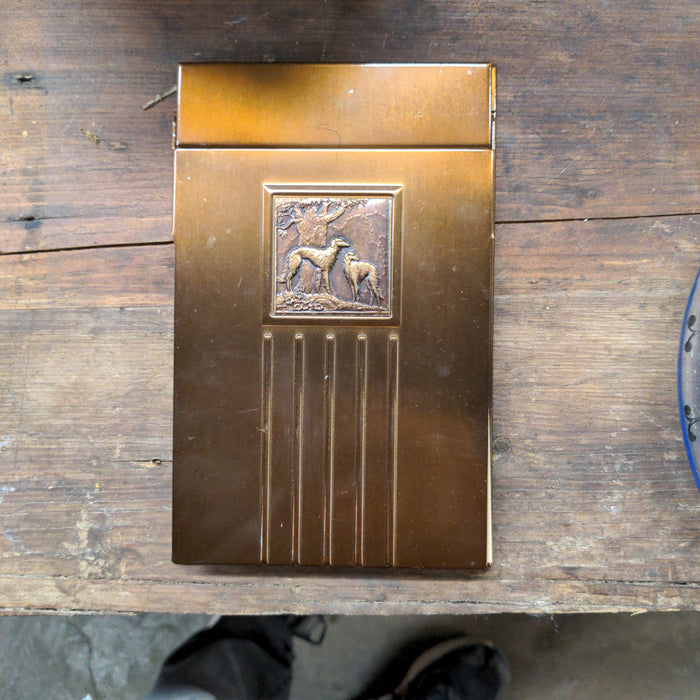 METAL COVER NOTEPAD WITH EMBOSSED DOGS