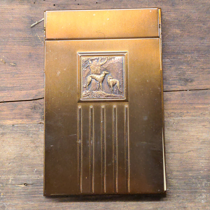 METAL COVER NOTEPAD WITH EMBOSSED DOGS