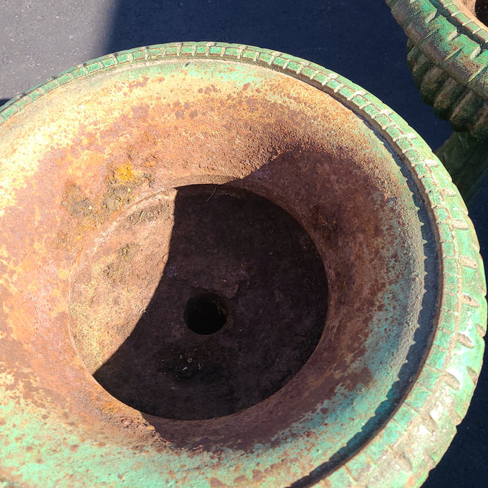 PAIR TALL GREEN IRON URNS