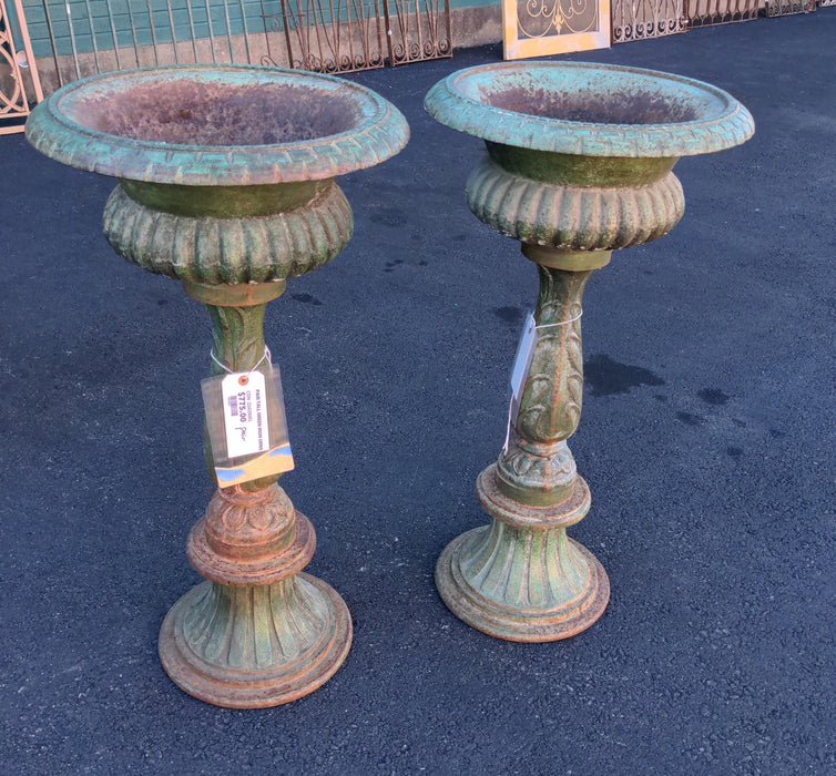 PAIR TALL GREEN IRON URNS