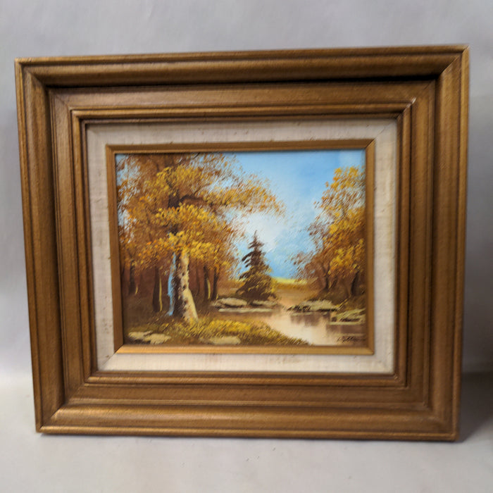 PINE TREE AND STREAM OIL PAINTING IN RUSTIC FRAME