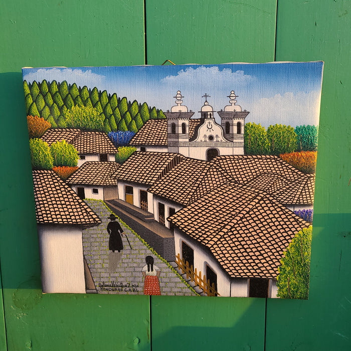 Small painting of honduran village church with priest