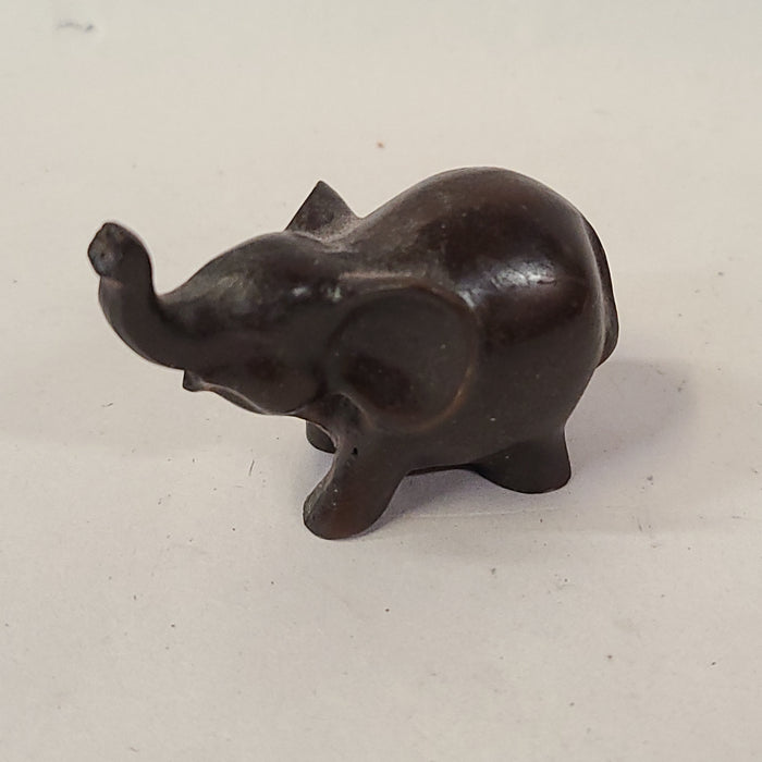 TINY CARVED WOOD ELEPHANT