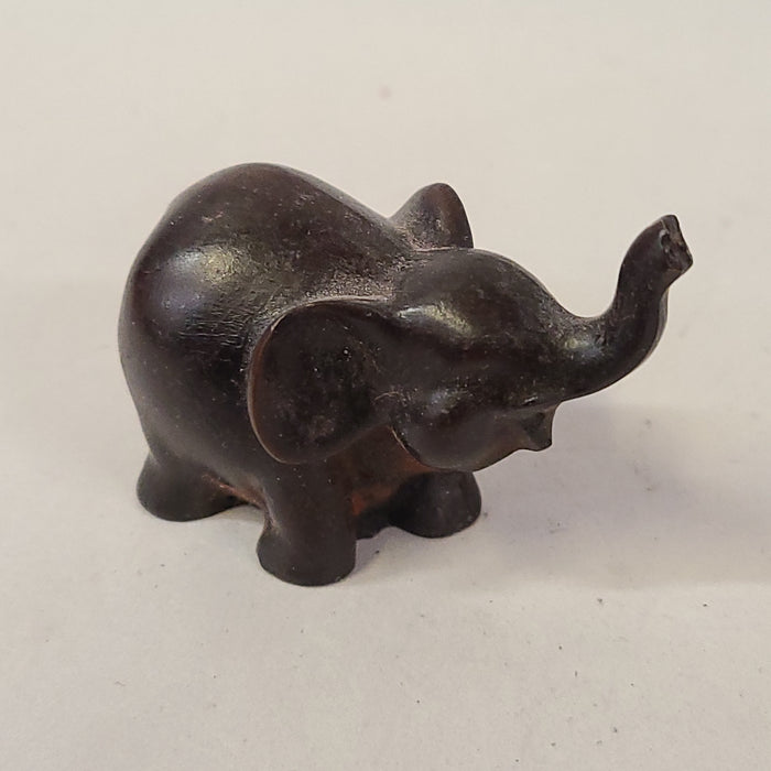 TINY CARVED WOOD ELEPHANT