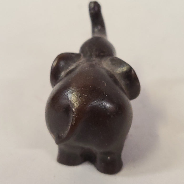 TINY CARVED WOOD ELEPHANT