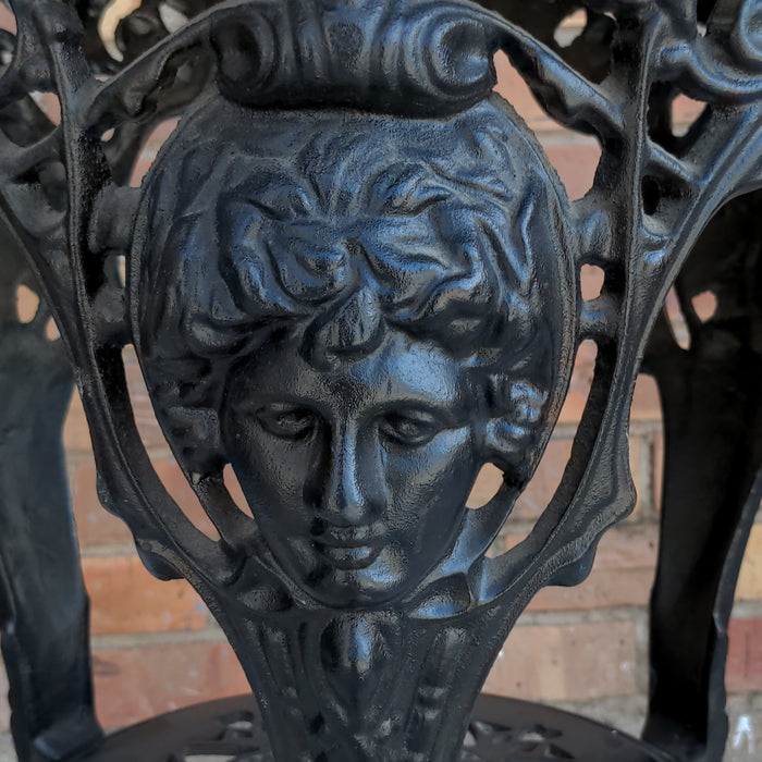 LIGHT MAHOGANY TOP CAST IRON PUB TABLE WITH FIGURAL MASKS