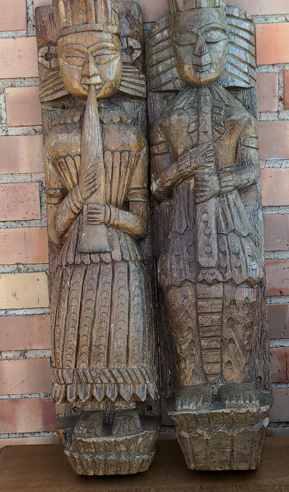 PAIR OF CARVED PRIMITIVE FIGURAL PILASTERS