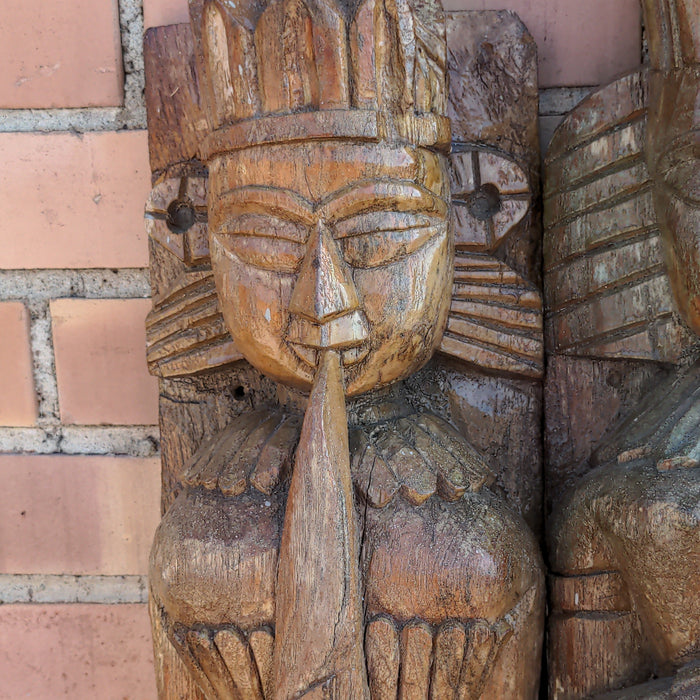 PAIR OF CARVED PRIMITIVE FIGURAL PILASTERS