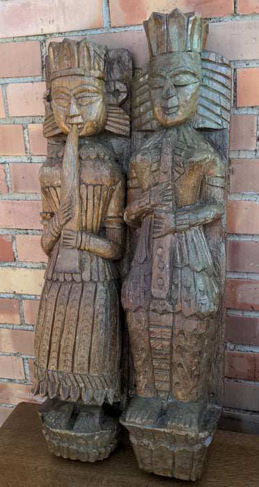 PAIR OF CARVED PRIMITIVE FIGURAL PILASTERS