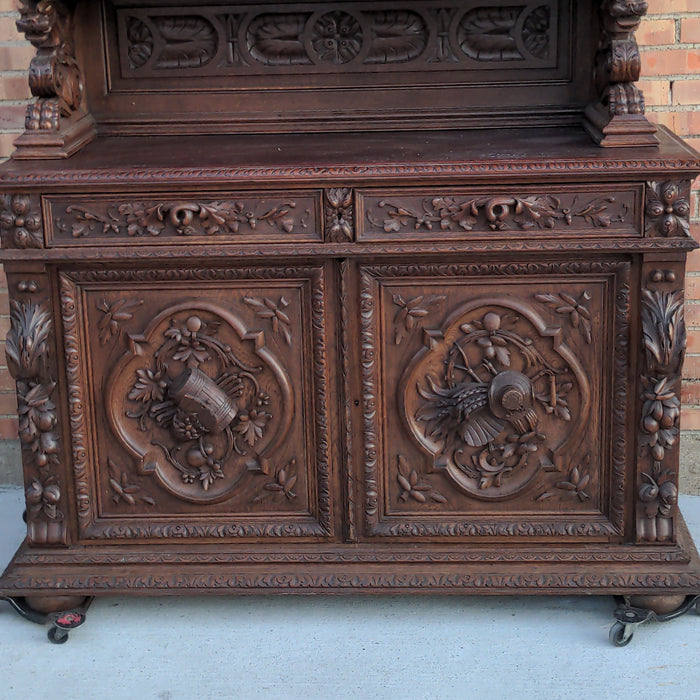 FIGURAL CARVED FRENCH OAK HUNTBOARD