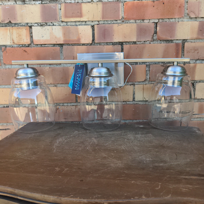 THREE LIGHT STAINLESS STEEL AND GLASS GLOBE SCONCE