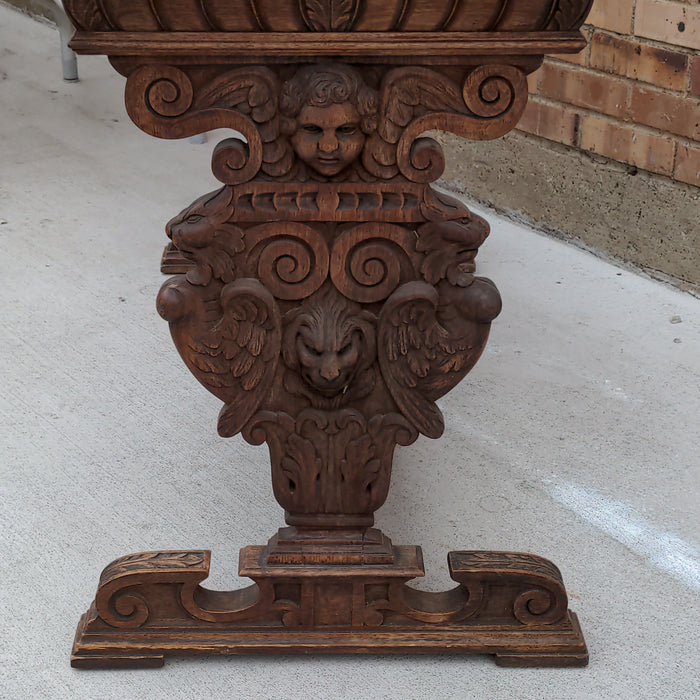 FRENCH CARVED OAK CONSOLE TABLE WITH LIONS AND CHERUBS