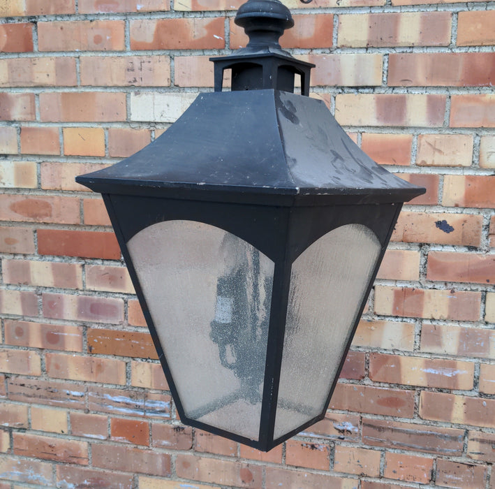 HANGING BLACK METAL AND GLASS LANTERN AS FOUND