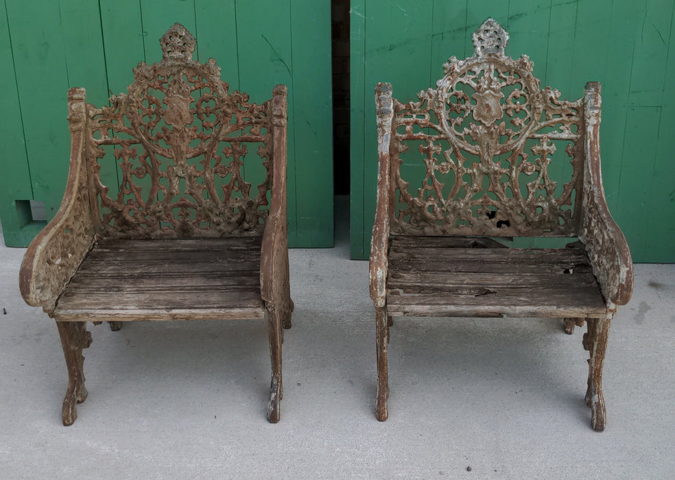 PAIR OF HEAVY CAST IRON ARM CHAIRS