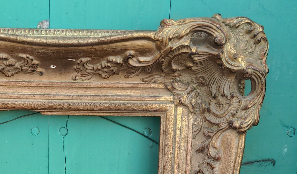 SMALL ORNATE GILTWOOD FRAME