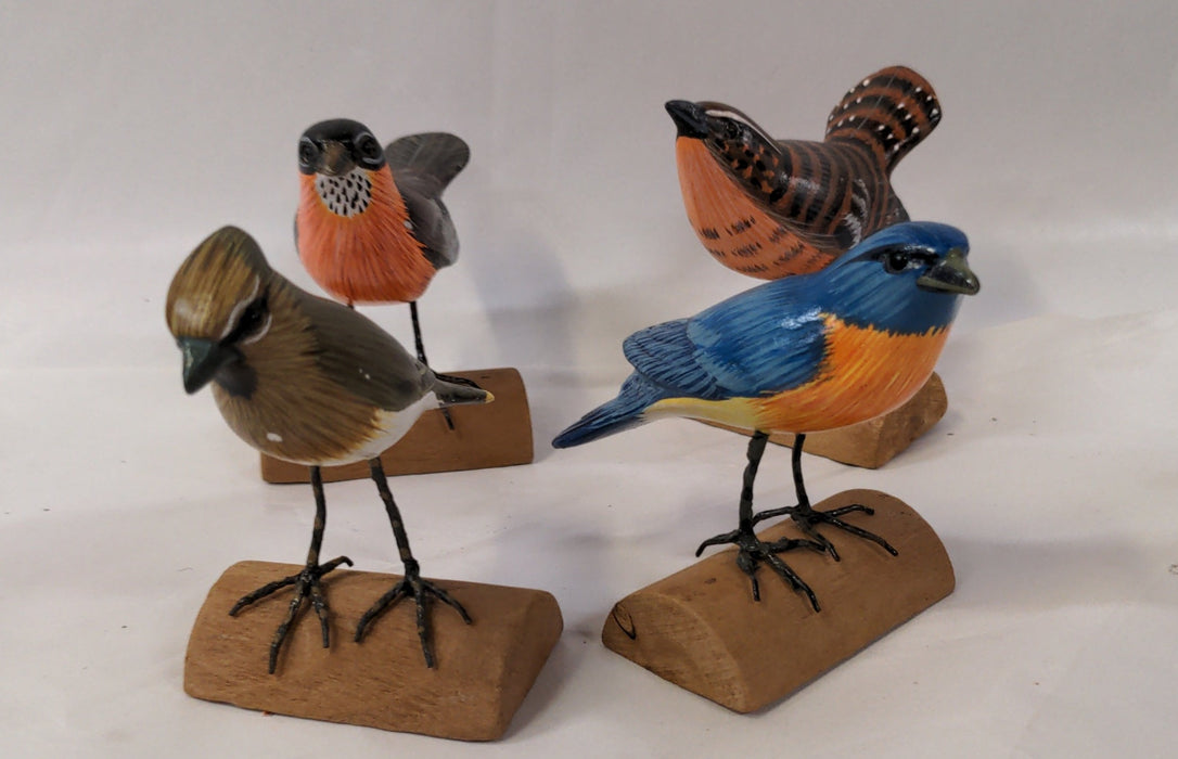 SET OF FOUR COLORFUL CARVED BIRDS