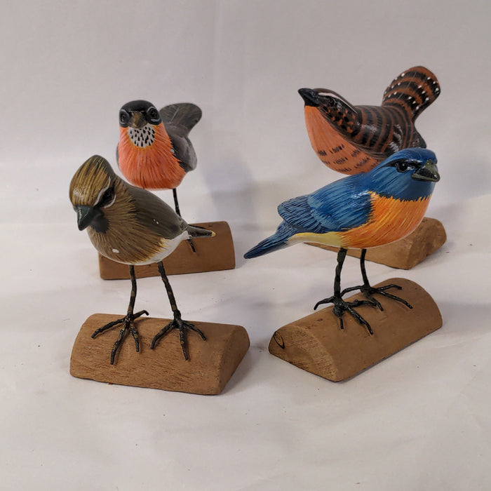 SET OF FOUR COLORFUL CARVED BIRDS
