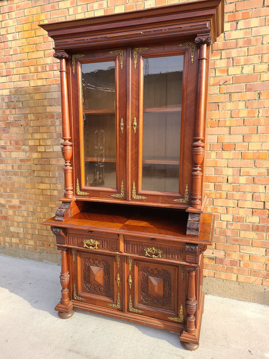 AUSTRIAN WALNUT BOOKCASE WITH GLASS UPPER DOORS AND CARVED LOWER DOORS