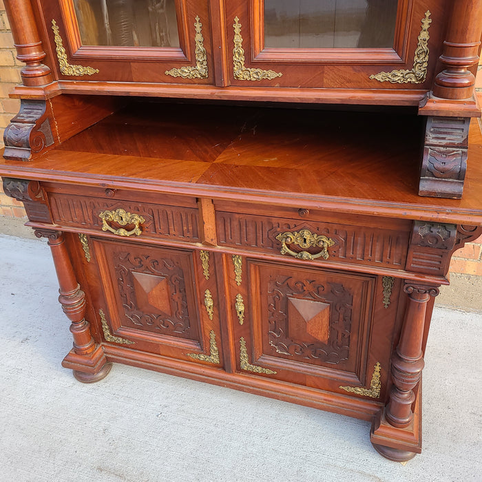 AUSTRIAN WALNUT BOOKCASE WITH GLASS UPPER DOORS AND CARVED LOWER DOORS