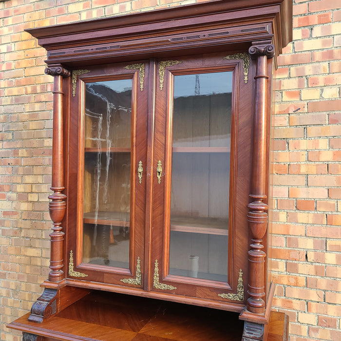 AUSTRIAN WALNUT BOOKCASE WITH GLASS UPPER DOORS AND CARVED LOWER DOORS