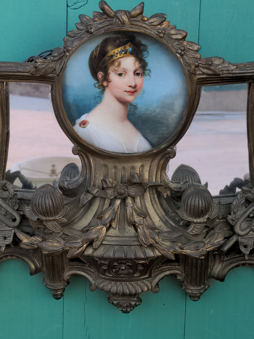 ORNATE ANTIQUE GILT BRASS SMALL WALL MIRROR WITH PORTRAIT IN CENTER