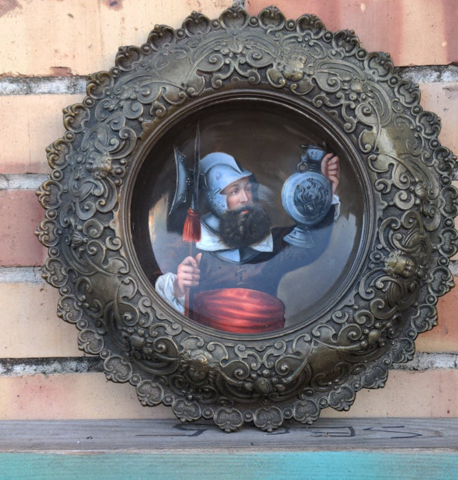 ANTIQUE HAND PAINTED PLATE WITH EUROPEAN SOLDIER & ORNATE METAL SURROUND