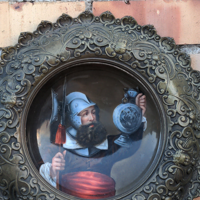 ANTIQUE HAND PAINTED PLATE WITH EUROPEAN SOLDIER & ORNATE METAL SURROUND