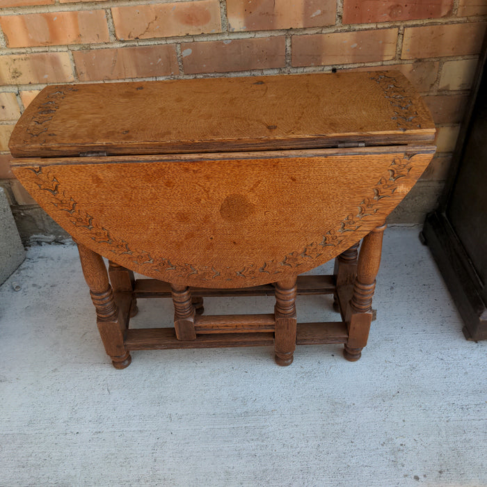 TINY OAK DROPLEAF TABLE WITH CARVED TOP