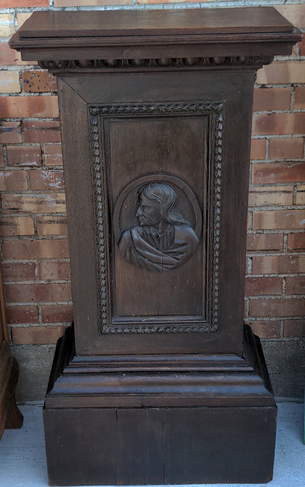 OAK PEDESTAL WITH CARVED MAN