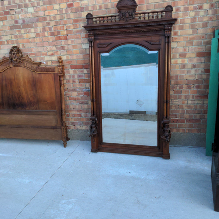 CARVED WALNUT JESTERS MIRROR WITH COLUMNS