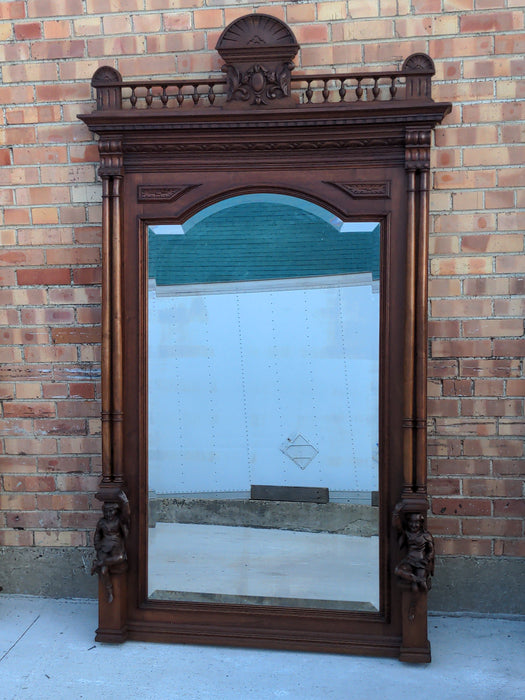 CARVED WALNUT JESTERS MIRROR WITH COLUMNS