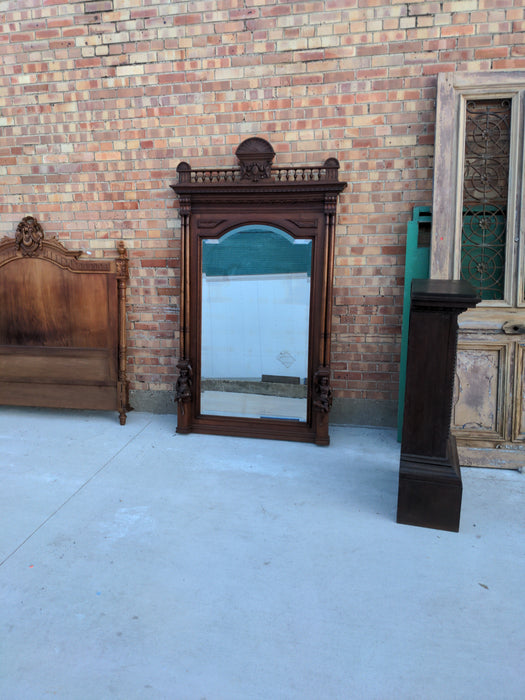 CARVED WALNUT JESTERS MIRROR WITH COLUMNS