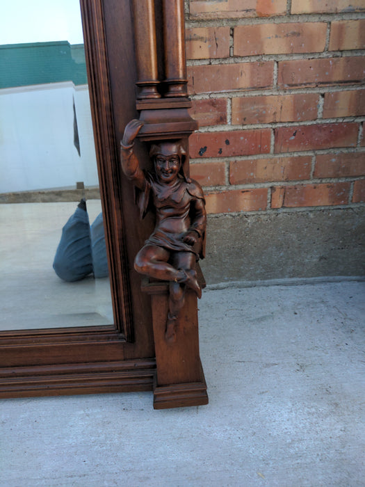 CARVED WALNUT JESTERS MIRROR WITH COLUMNS