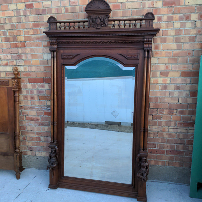 CARVED WALNUT JESTERS MIRROR WITH COLUMNS