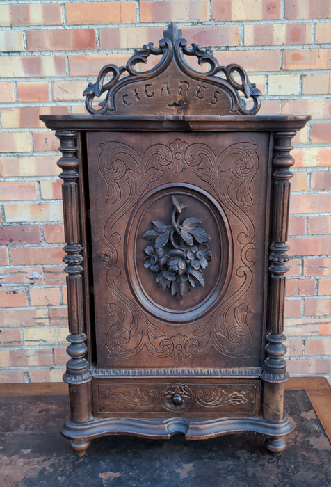 FRENCH  WALNUT TOBACCO CABINET WITH "CIGARES" AND FLORAL CARVED DOOR