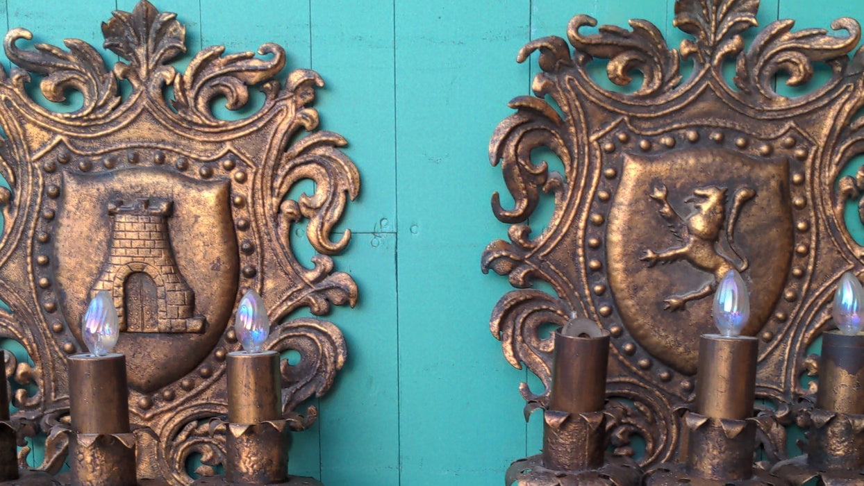PAIR OF HERALDIC SHIELD MOTIF SCONCES, GILT PAINTED IRON
