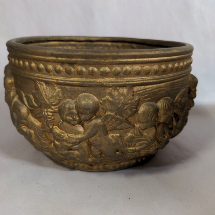 ROUND BRASS COLOR POTTERY PLANTER WITH GOATS AND CHERUBS